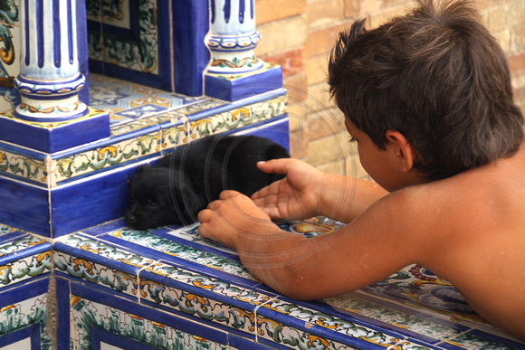 Sevilla, Plaza de Espana, Boy and Puppy1034874a